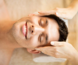 healthcare, spa and beauty concept - man in spa salon